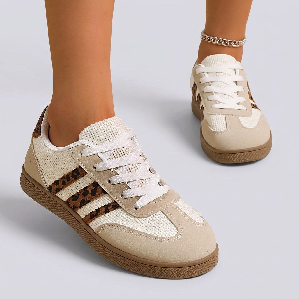 Essyro retro low-top sneakers in beige with leopard print stripes, suede-effect panels, and white laces.