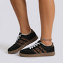 Essyro retro low-top sneakers in black with leopard print side stripes, suede-effect panels, and gum rubber soles.