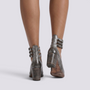 Essyro silver snake-effect leather block heel shoes with triple ankle buckles, viewed from the back.