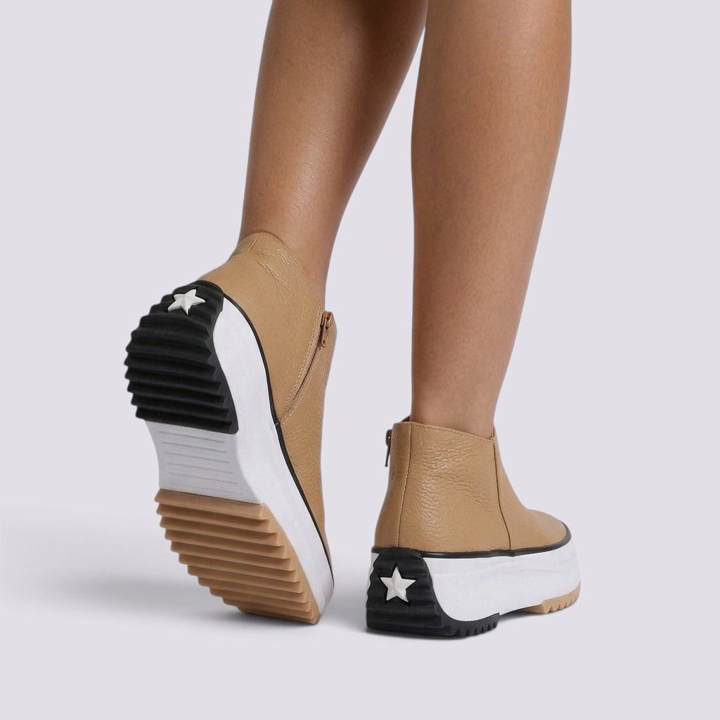 Essyro tan leather platform ankle boots with side zipper and star detail on the chunky treaded sole