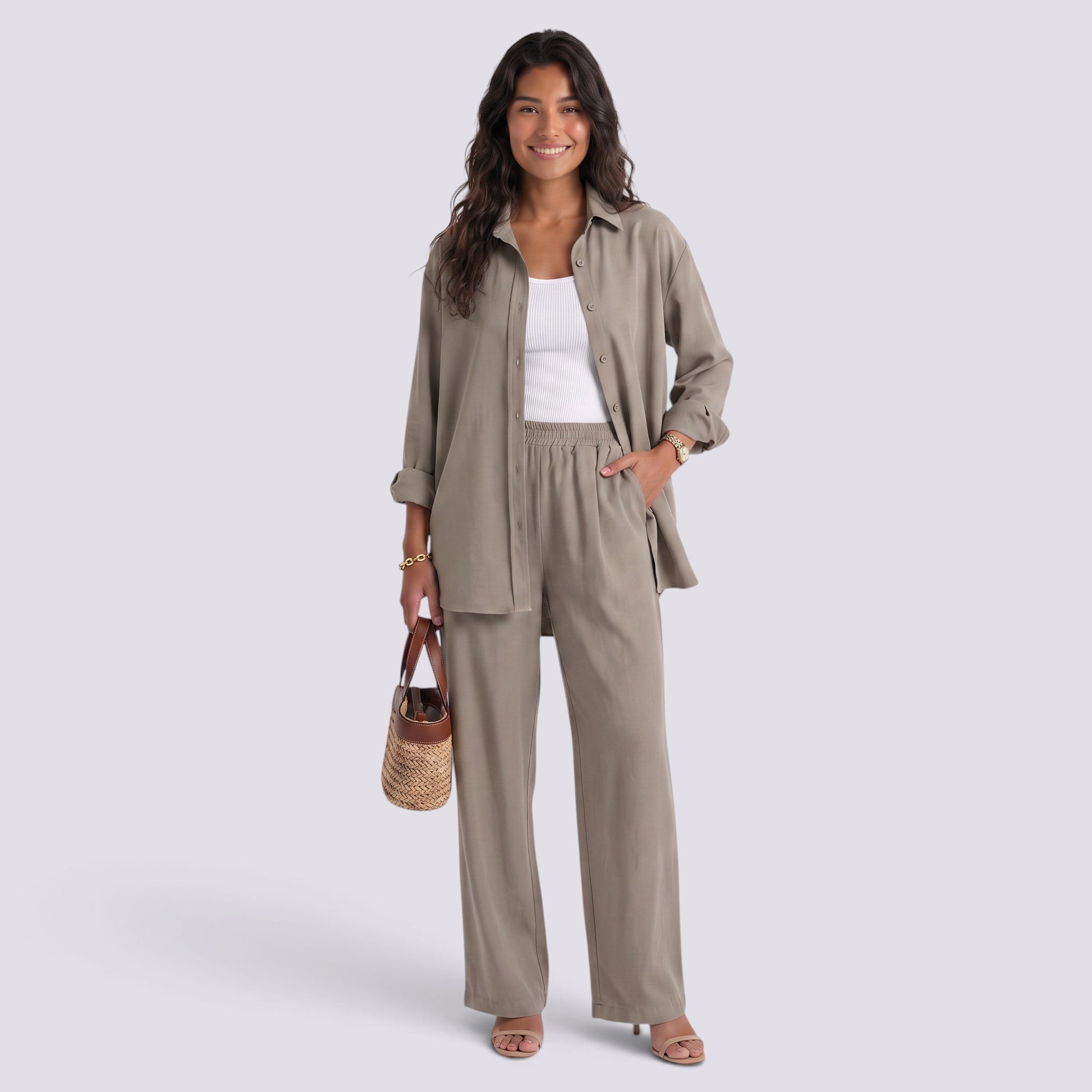 Essyro two-piece set featuring a taupe loose-fit long-sleeve shirt and matching wide-leg trousers on a smiling model.