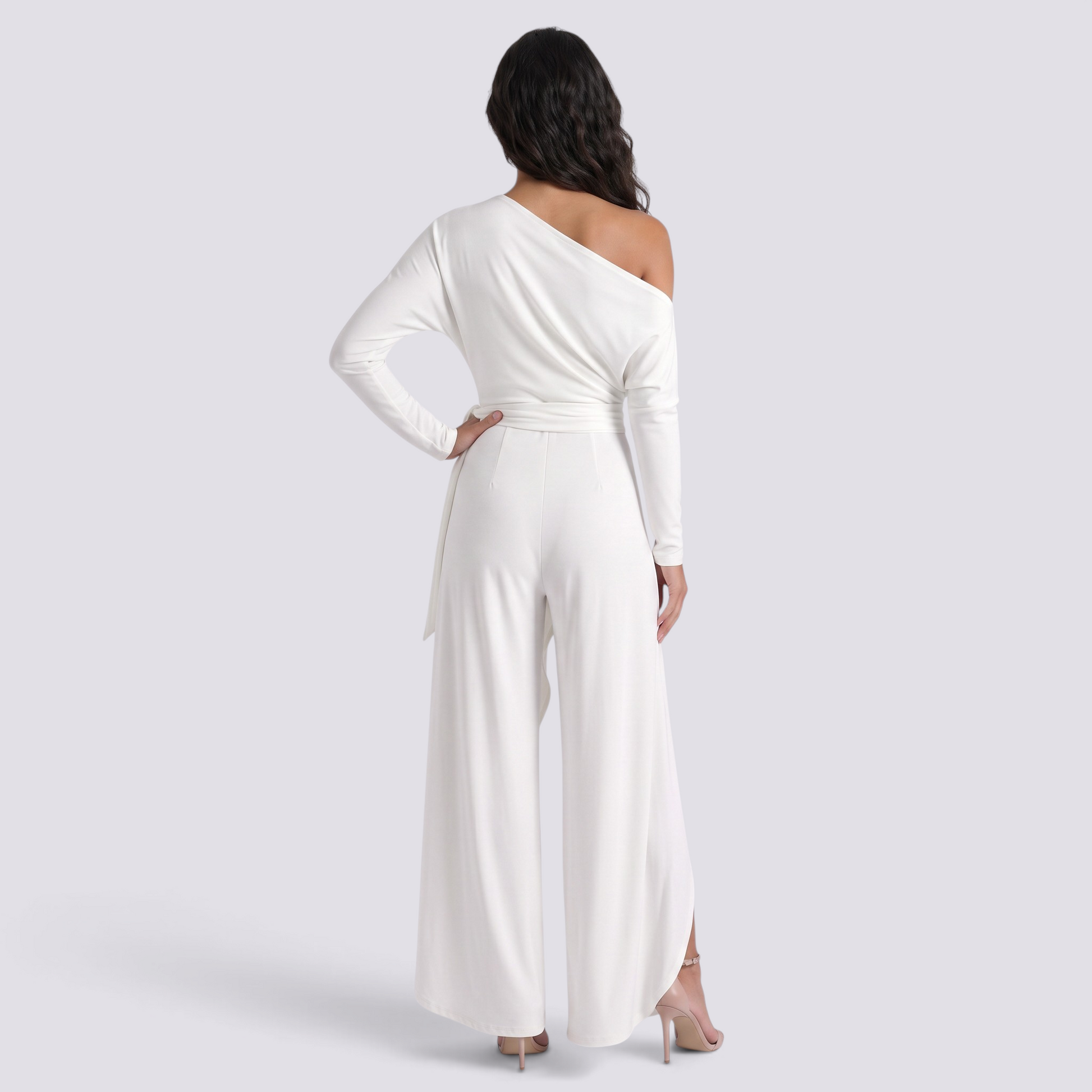 Essyro white one-shoulder jumpsuit with long draped sleeve and wide-leg trousers, back view on a model.