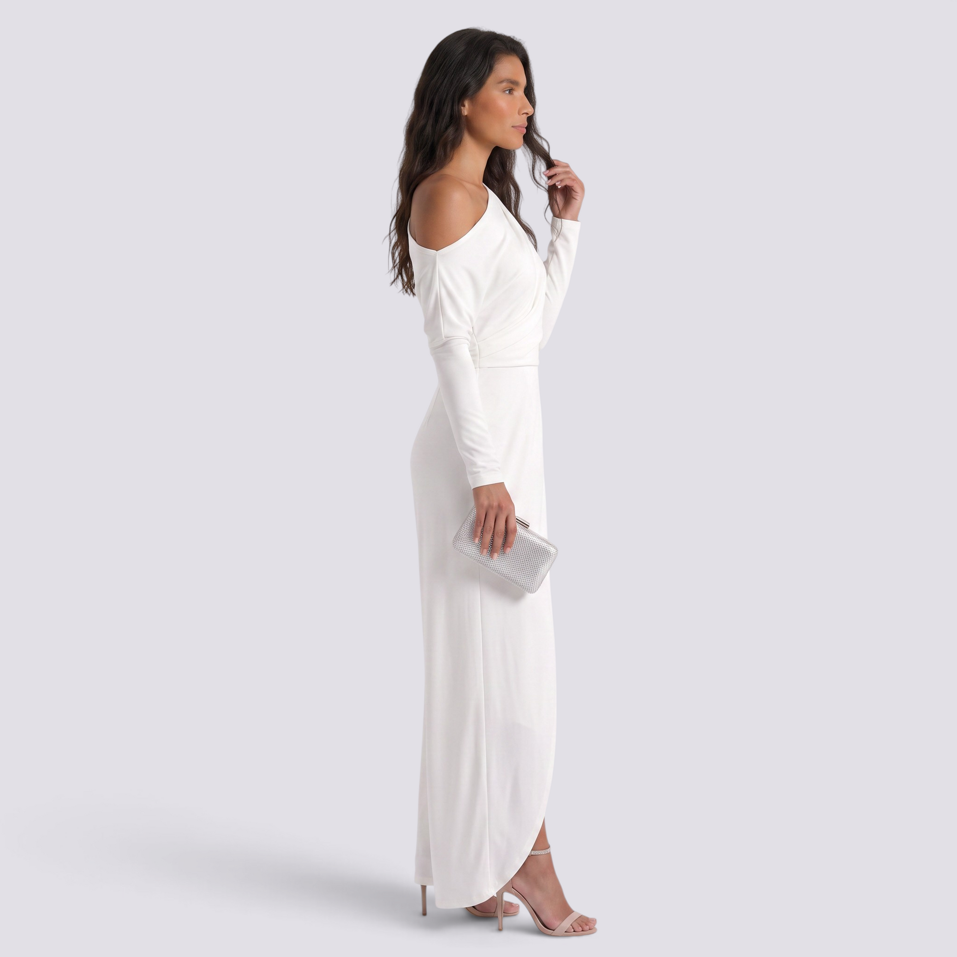Essyro white one-shoulder jumpsuit with long draped sleeve and wide-leg wrap design worn by a model with a clutch