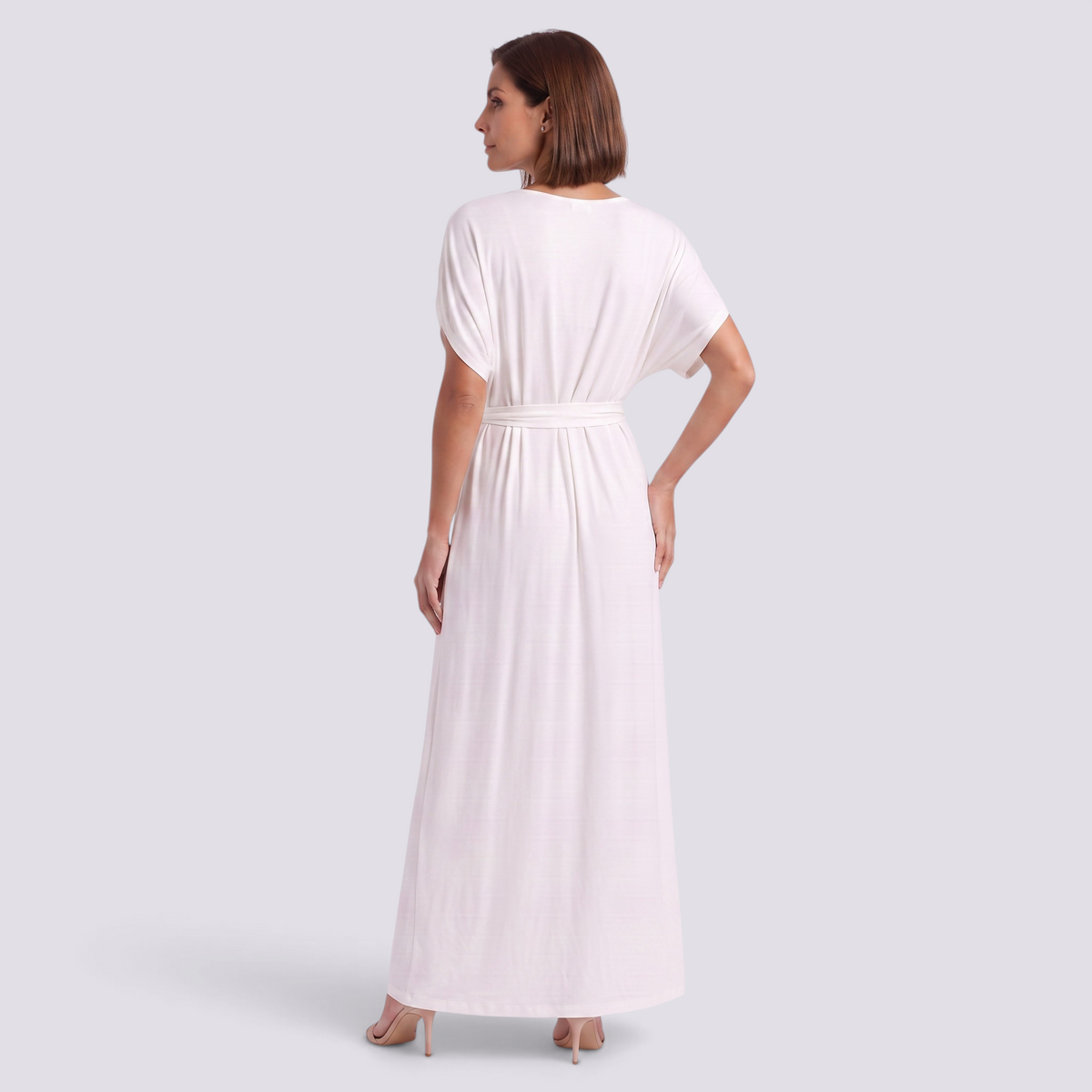 Essyro plus size elegant white floor-length maxi dress with short sleeves and waist tie viewed from the back
