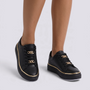 Zapatillas mujer negras con plataforma, ribete dorado y cadenas doradas, vista frontal