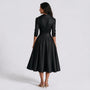 Vestido entallado manga larga color negro, vista trasera