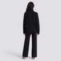 Conjunto de jersey de cuello alto con cremallera y pantalón ancho de punto negro, vista trasera