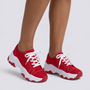 Zapatillas deportivas de mujer rojas con suela ondulada y cordones, vista frontal