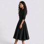 Vestido entallado manga larga color negro, vista lateral