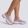Zapatillas deportivas de mujer rosas con suela ondulada y cordones, vista lateral