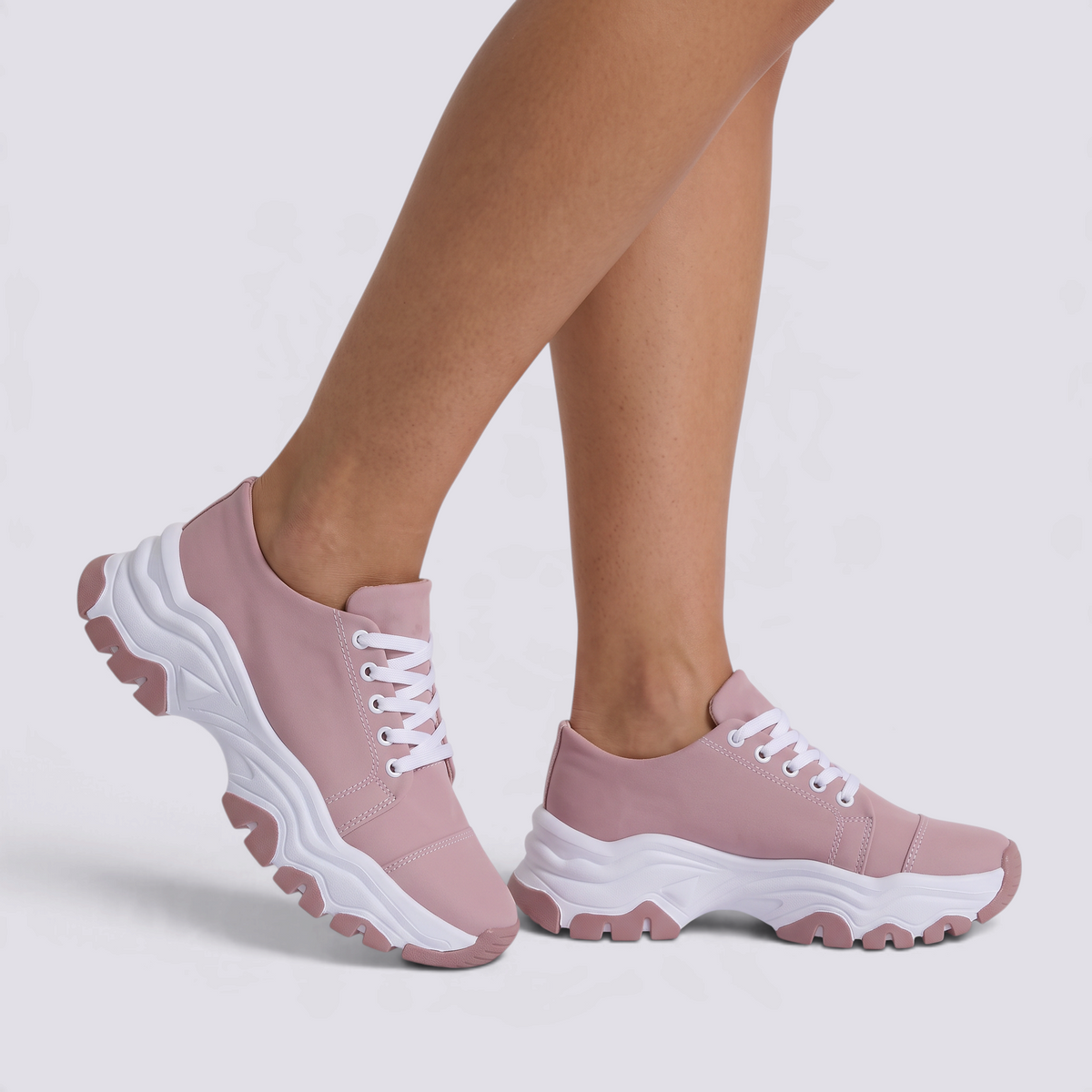 Zapatillas deportivas de mujer rosas con suela ondulada y cordones, vista lateral