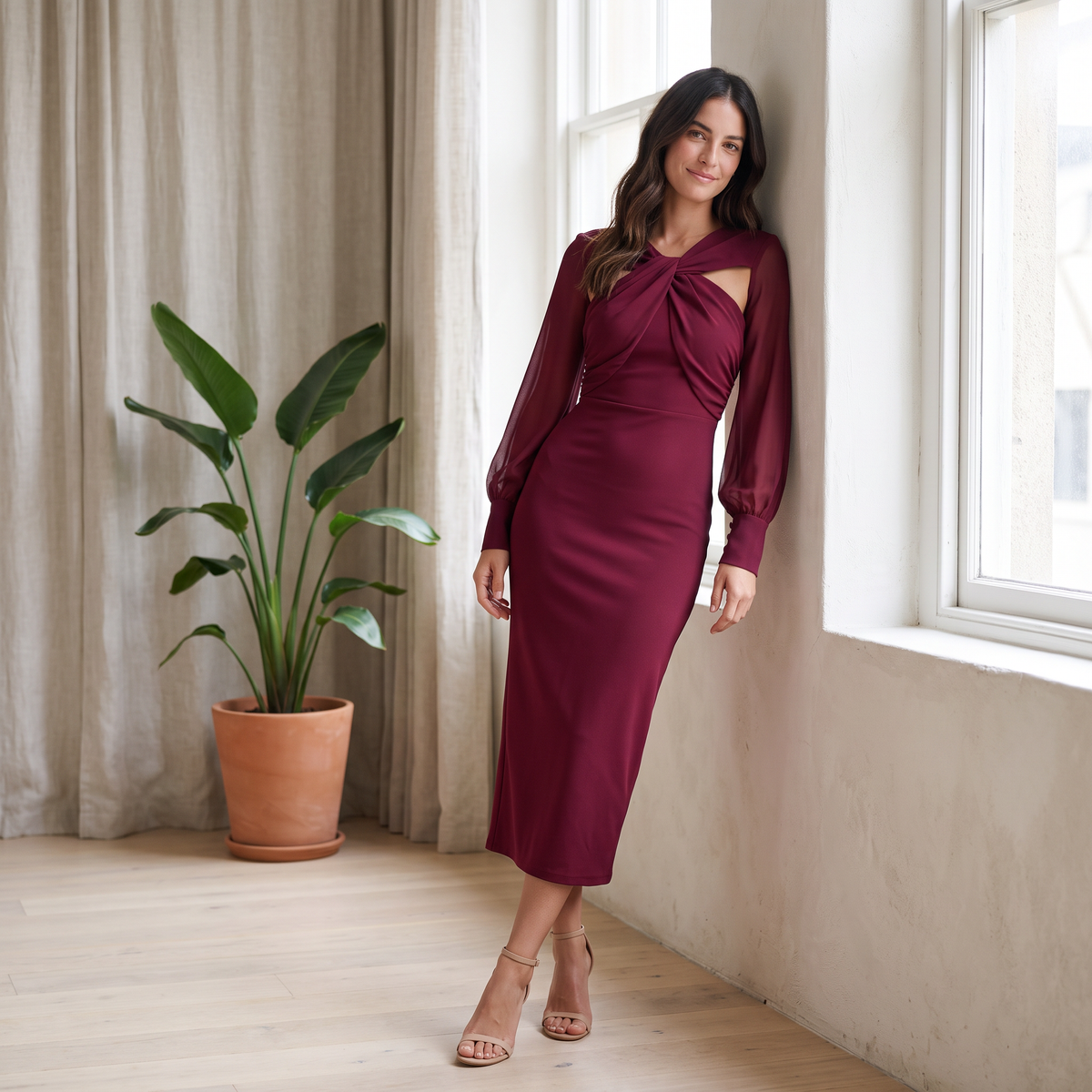Mujer con vestido midi escote cruzado manga globo rojo en un loft luminoso