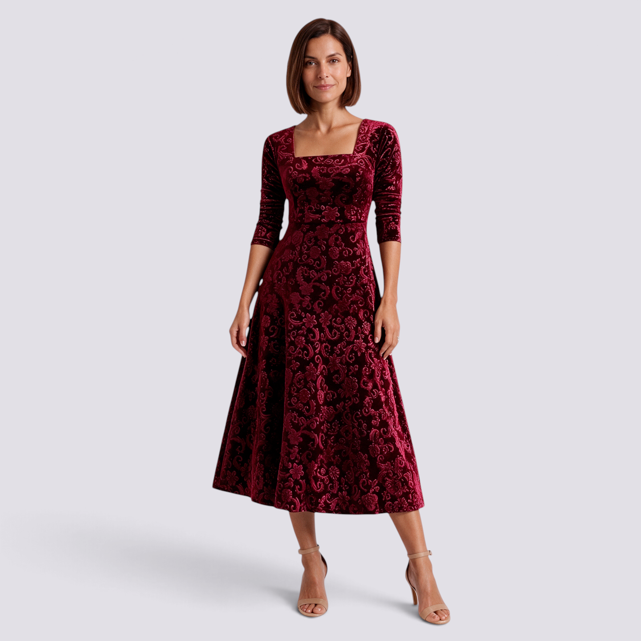 Essyro midi dress in deep red velvet with floral jacquard pattern, square neckline, and A-line skirt on a model.