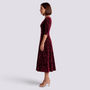 Essyro burgundy velvet midi dress with floral jacquard pattern, square neckline, and A-line skirt, side view