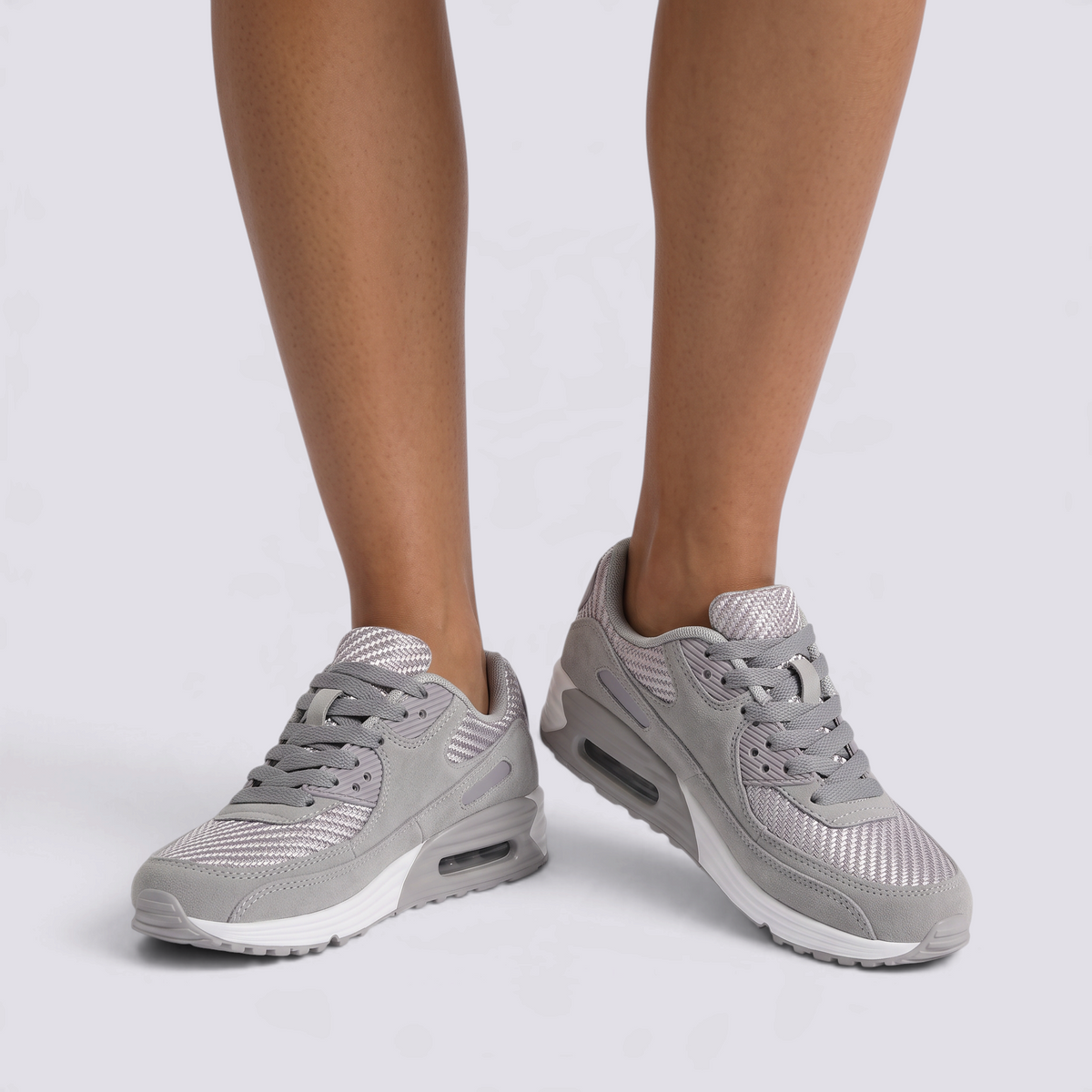 Zapatillas deportivas mujer con cámara de aire en gris, vista frontal