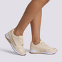 Zapatillas deportivas mujer con detalle metalizado beige vista lateral